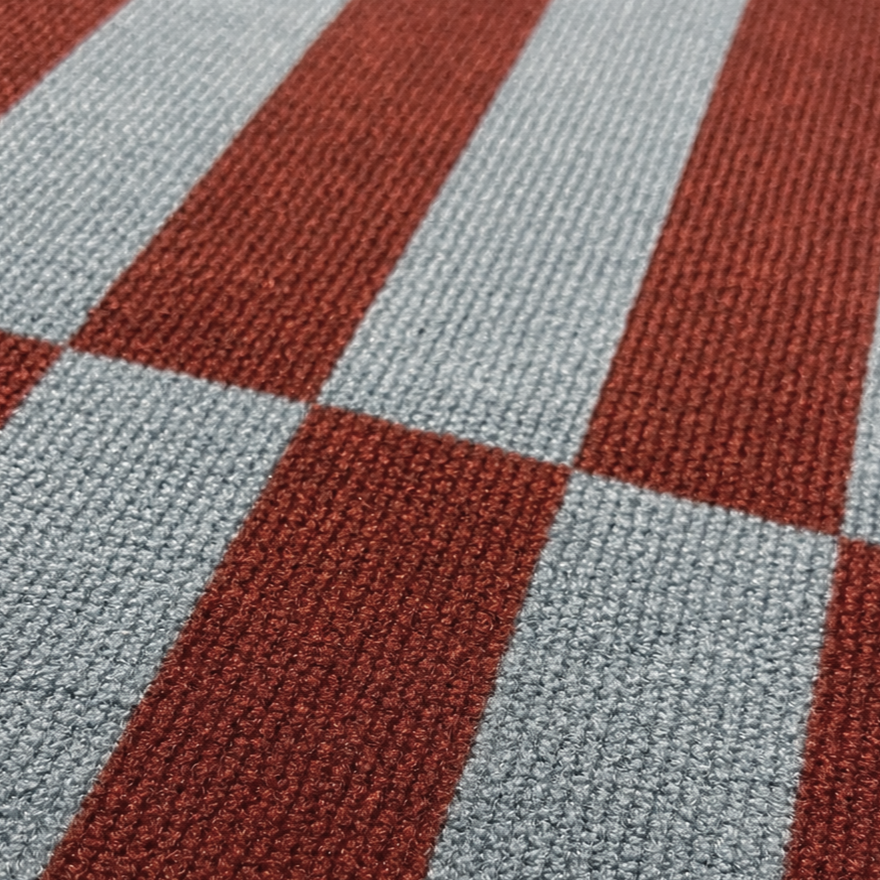 Close-up of a checkered pattern with red and gray blue squares